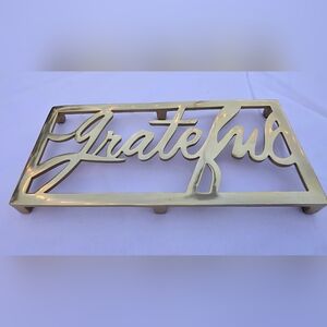 Gold “Grateful” Metal Trivet | Footed Brass-Tone Table Decor